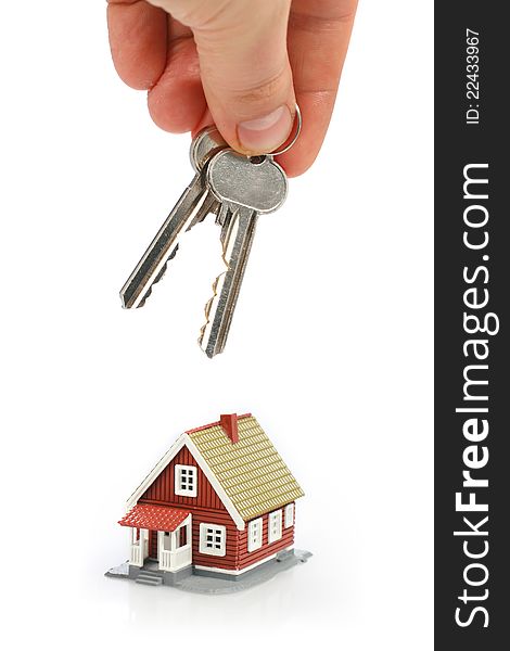 Keys and little house isolated over white background. Keys and little house isolated over white background.