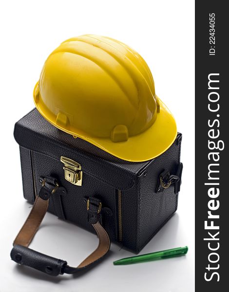 Construction concept - case and hard hat
