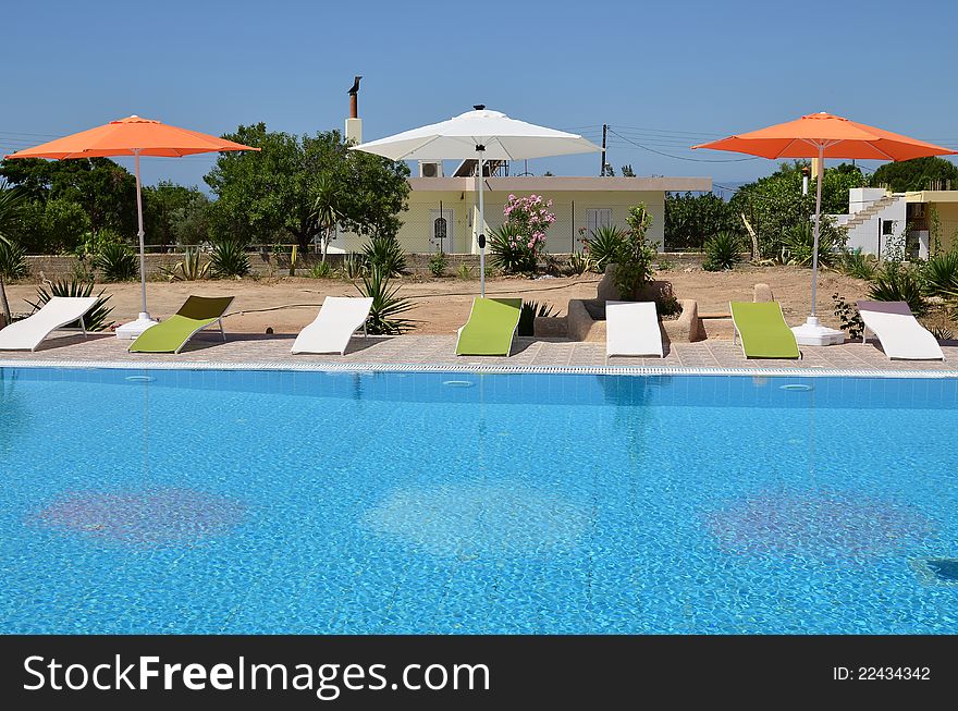 Swimming Pool And Sun Loungers