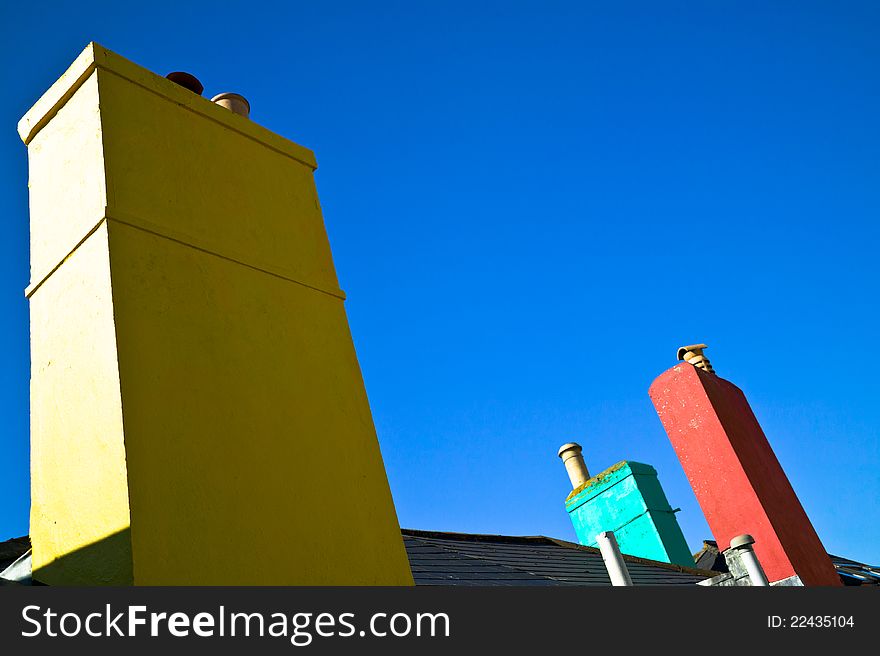 Colorful chimneys, with a blue sky, Devon, Uk