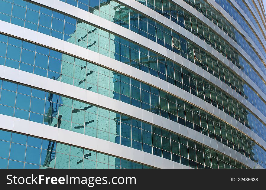 Reflections on office building blue glass wall. Reflections on office building blue glass wall