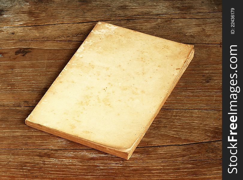 Old Book On Wooden Background