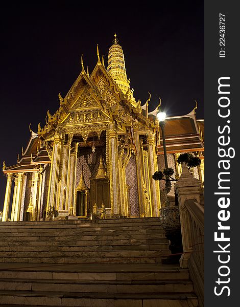 Buddhist temple Grand Palace at night in Bangkok, Thailand