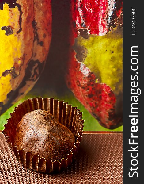 Cacao background and chocolate truffles