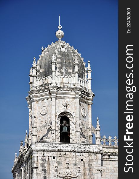 This intricately carved tower, housing the bells, is near the front entrance of the monastery of Jeronimos in Lisbon portugal ( mosteiro dos jeronimos ). This intricately carved tower, housing the bells, is near the front entrance of the monastery of Jeronimos in Lisbon portugal ( mosteiro dos jeronimos )