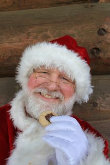 Cookie Eating Santa Royalty Free Stock Images