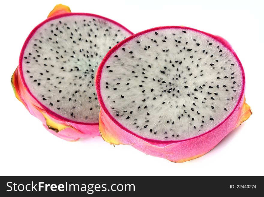 Closeup photo of fresh Dragon Fruit cut in half, on white background