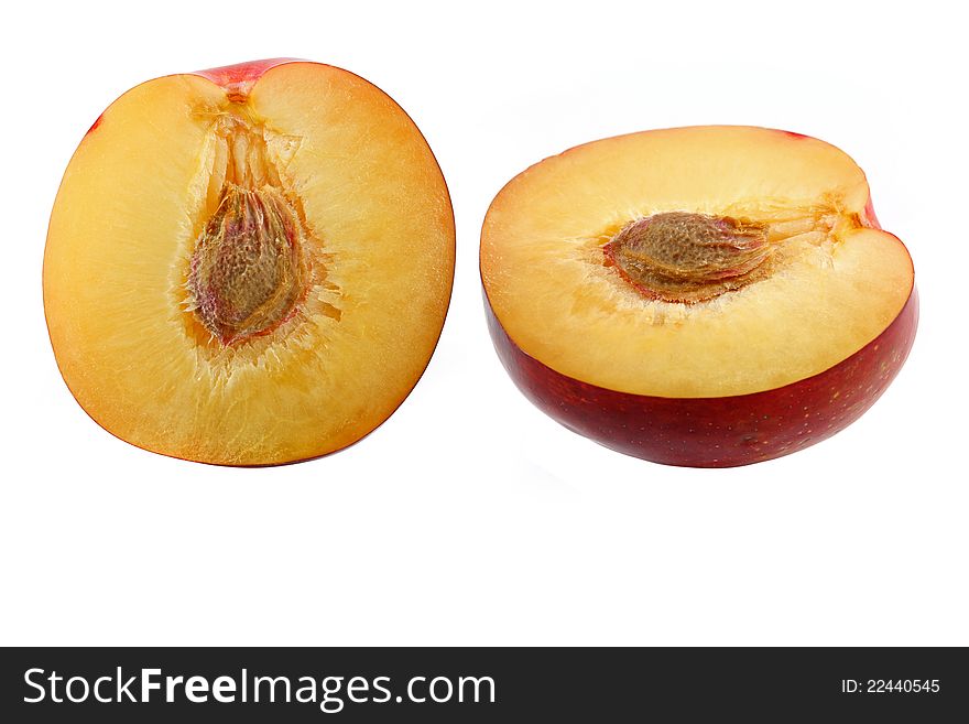 Half of fresh Nectarine with seed, isolated on a white background