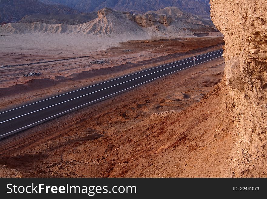 High road in stone desert