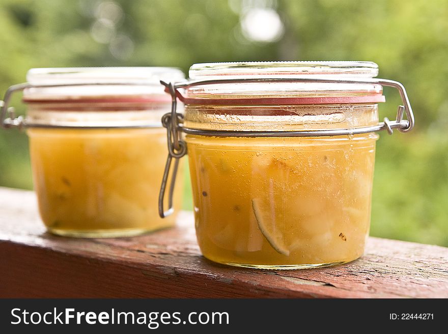 Two jars of melon jam on the wooden surface. Two jars of melon jam on the wooden surface