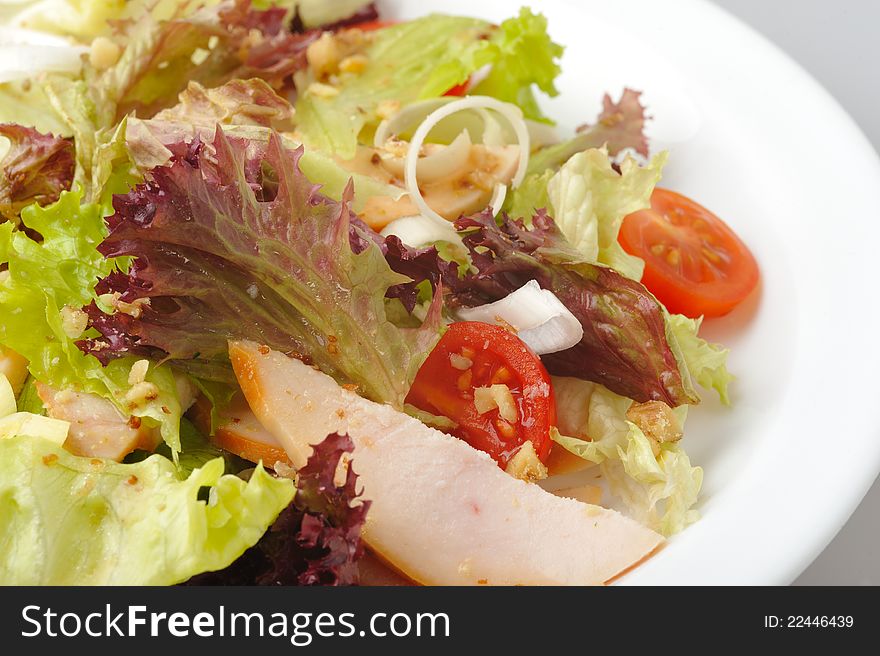 Vegatables and smoked chiken salad with cherry tomatos