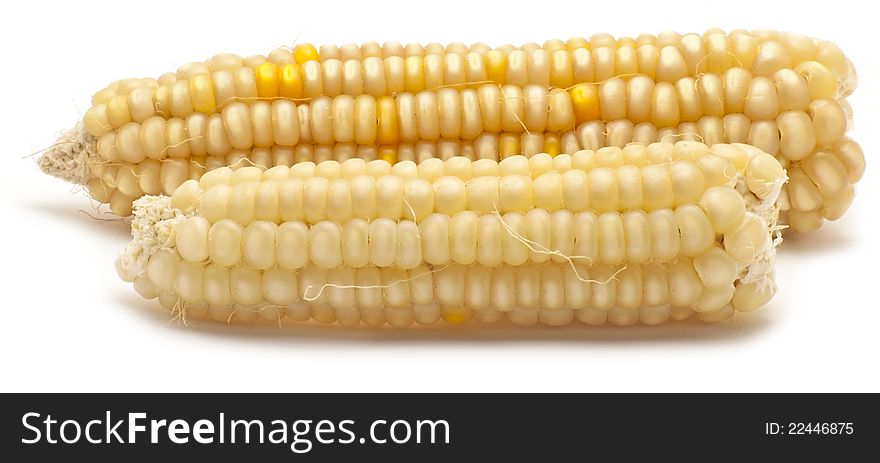 Two pieces of corn on white background