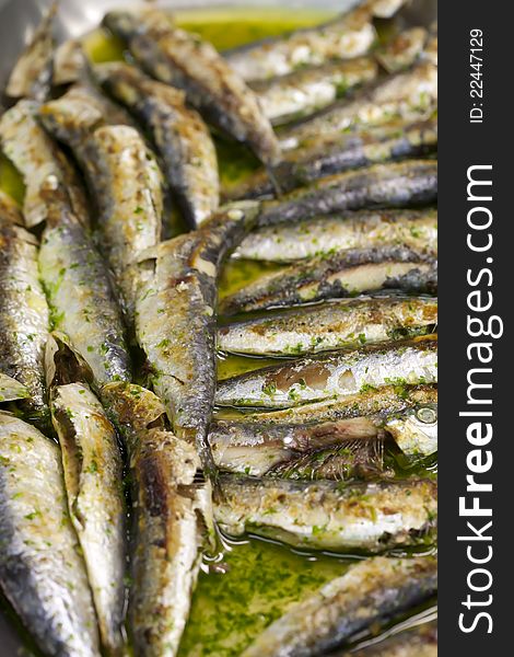 Sardines are baked in the oven with garlic and parsley. Sardines are baked in the oven with garlic and parsley