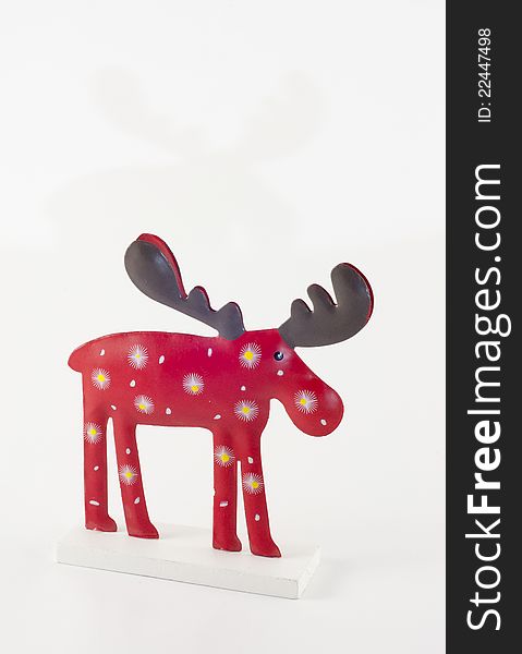 Reindeer handmade wooden figure on white background. Reindeer handmade wooden figure on white background.