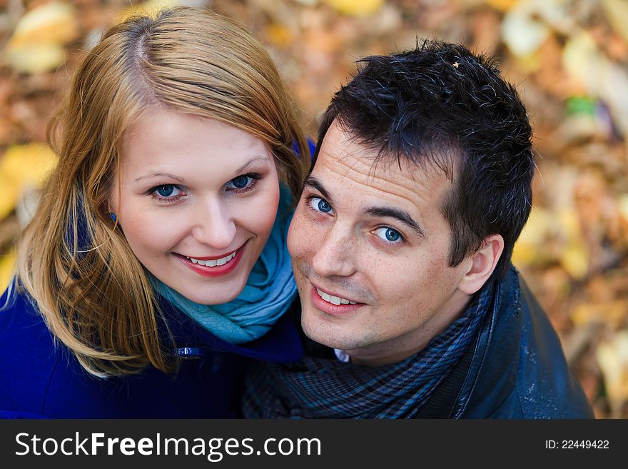 Happy Couple Standing Together in the Park During Autumn. Happy Couple Standing Together in the Park During Autumn