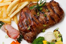 Garnished Plate Of Grilled Steak Meat Royalty Free Stock Image