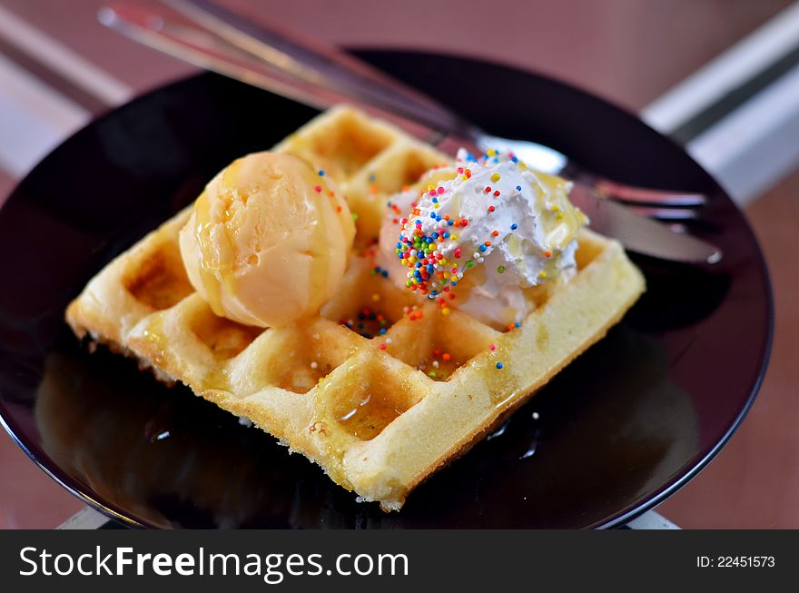 Waffle and whipping cream with vanilla ice cream