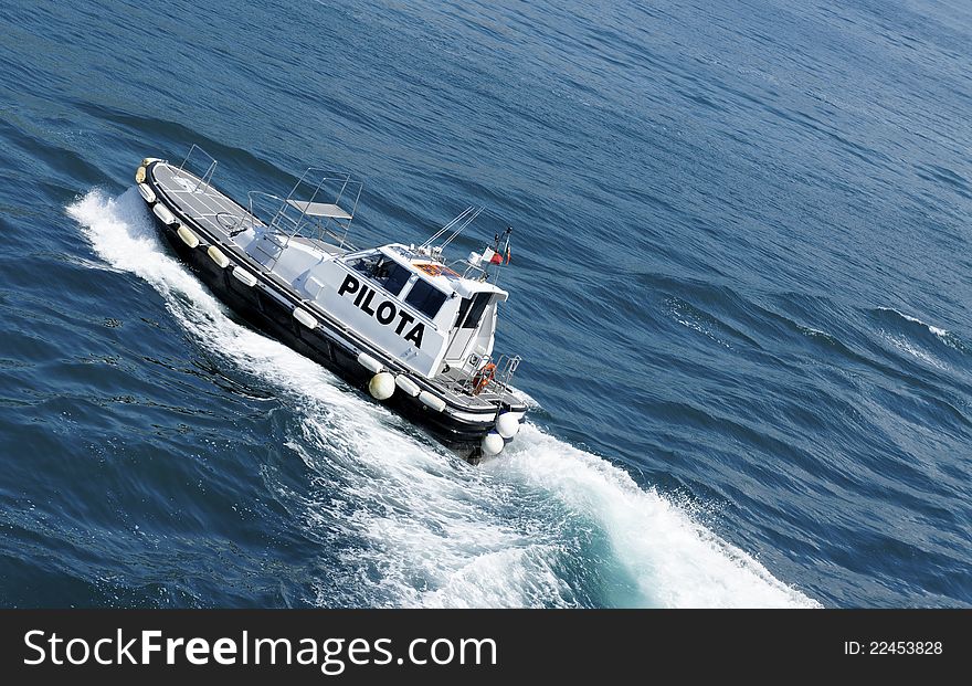 Pilot boat approacing a ship during a arrival in the port of salerno