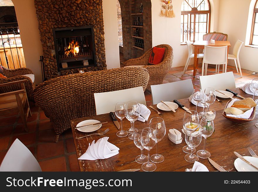 Restaurant Interior With Set Table And Fireplace