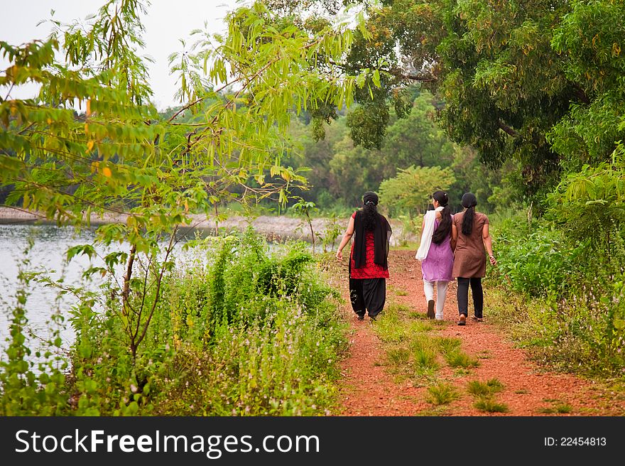 Three indian female at morning very near to lake. Three indian female at morning very near to lake