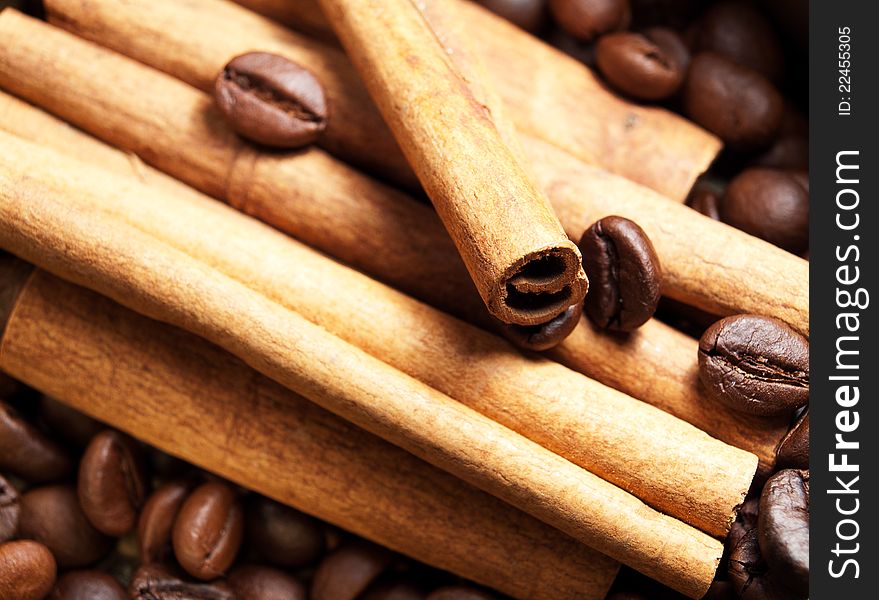 Coffee beans and cinnamon background