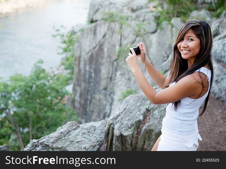 Woman Photographing Scenic River