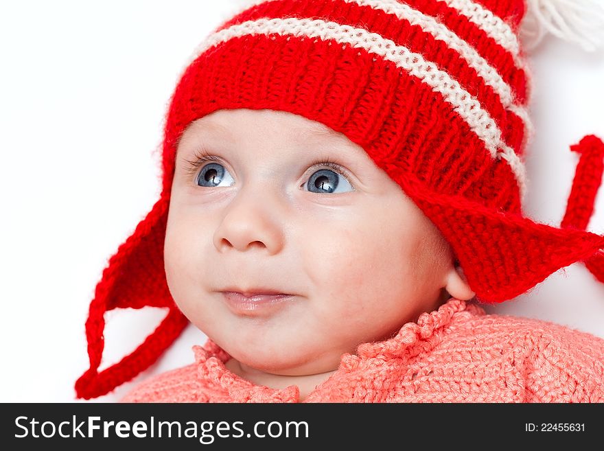 Cute smiling baby in red hat on white. Cute smiling baby in red hat on white