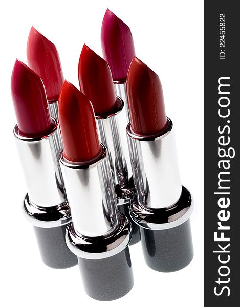 Set of six red lipsticks isolated