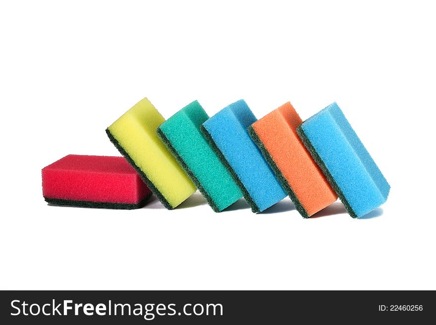 Colorful sponges for washing dishes on a white background