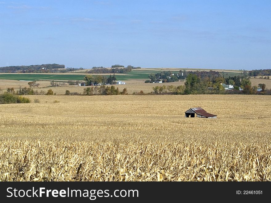 An equipment shed sits idle waiting for the corn harvest. An equipment shed sits idle waiting for the corn harvest.