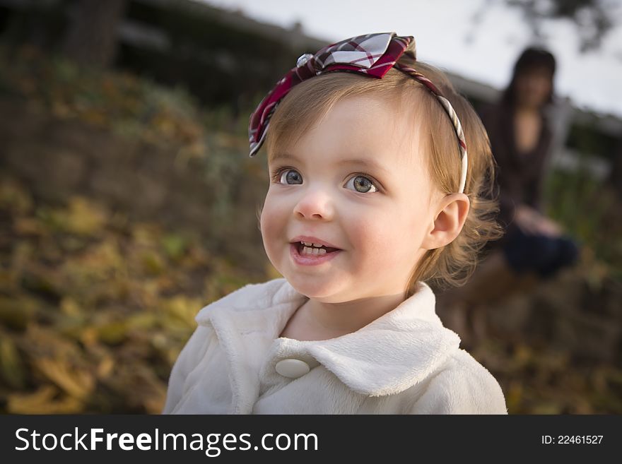 Adorable Baby Girl Playing in Park with Mom