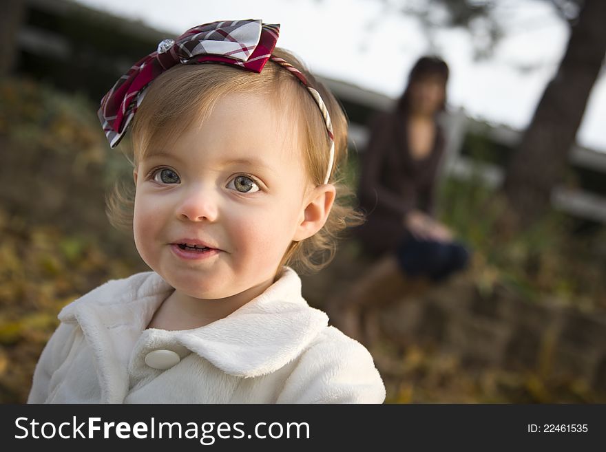 Adorable Baby Girl Playing in Park with Mom