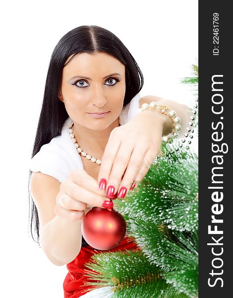 Beautiful woman near a Christmas tree with christmas balls. Isolated over white background