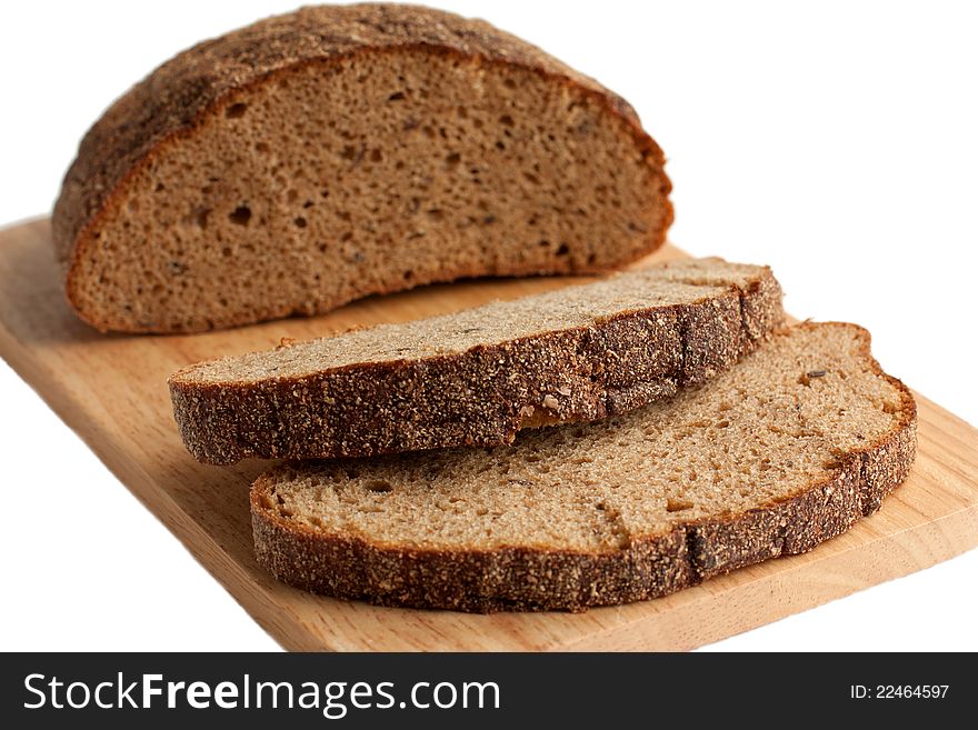 A delicious brown bread on the cutting board