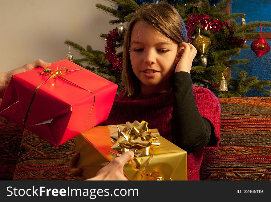 Happy white family sharing christmas gifts. Happy white family sharing christmas gifts