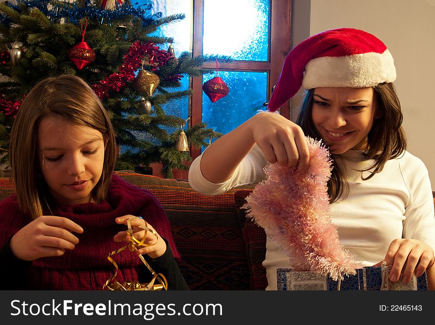 Two white girls having fun with christmas gifts. Two white girls having fun with christmas gifts