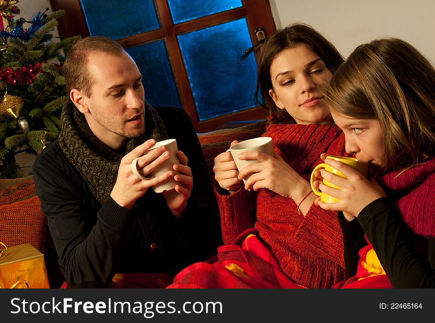 White people drinking cup of tea and sharing chirstmas moments. White people drinking cup of tea and sharing chirstmas moments