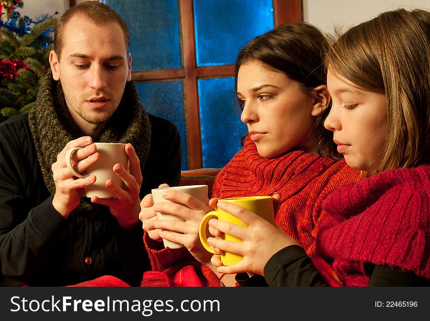 White people drinking cup of tea and sharing chirstmas moments. White people drinking cup of tea and sharing chirstmas moments