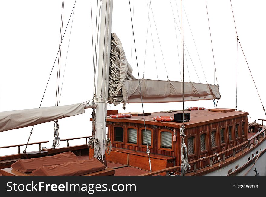 The details of an old wooden sailboat against white background. The details of an old wooden sailboat against white background.