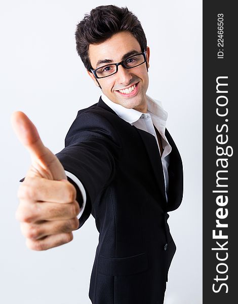 Portrait of attractive young businessman making the sign of Ok to the camera. Portrait of attractive young businessman making the sign of Ok to the camera