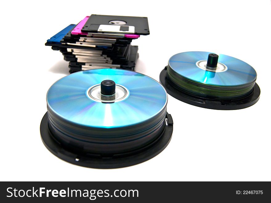 Floppy disks and cd on white