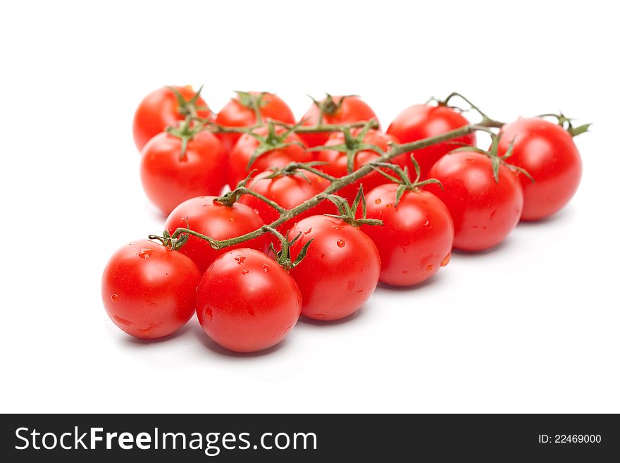 A group of beautiful, tasty, wet cherry tomatos on white background. A group of beautiful, tasty, wet cherry tomatos on white background