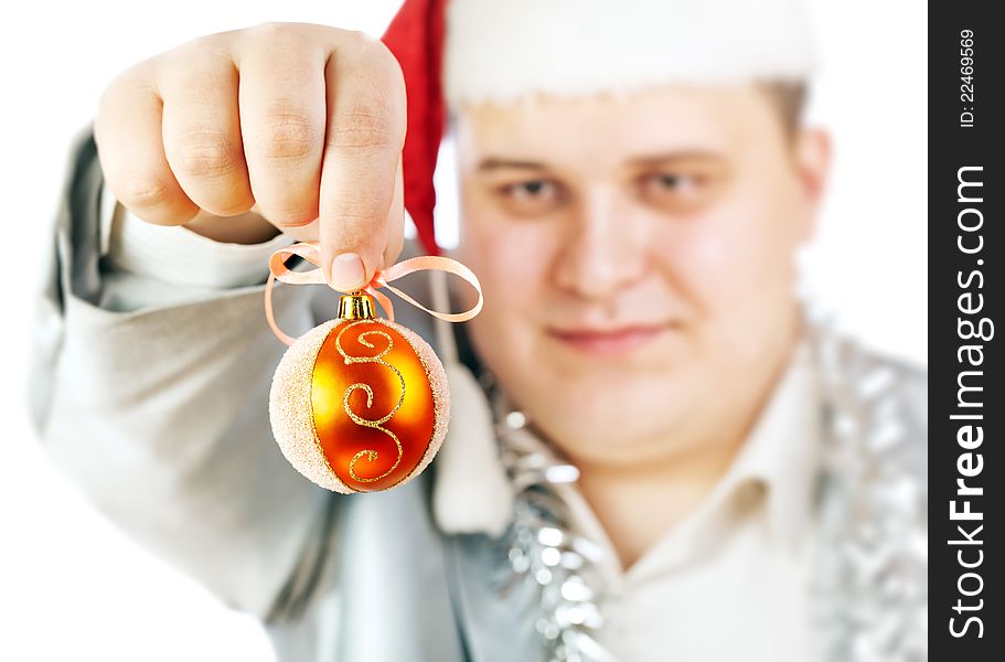 Young man holding a Christmas toy. Isolated on white background.Soft focus.