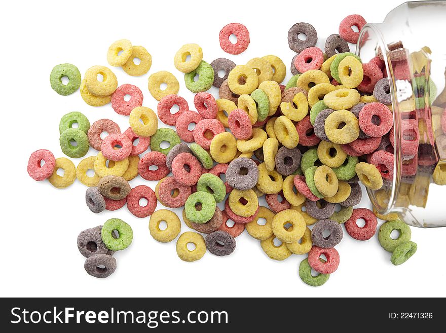 Sugary cereals in a glass jar on white background