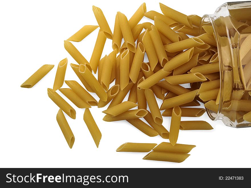 Dried pasta in a glass jar on white background. Dried pasta in a glass jar on white background