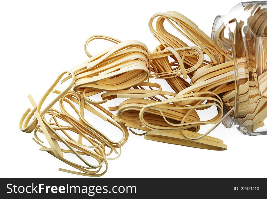 Dried pasta in a glass jar on white background. Dried pasta in a glass jar on white background