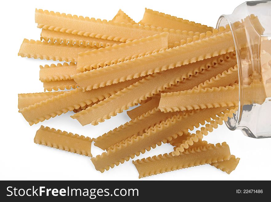 Dried pasta in a glass jar on white background. Dried pasta in a glass jar on white background