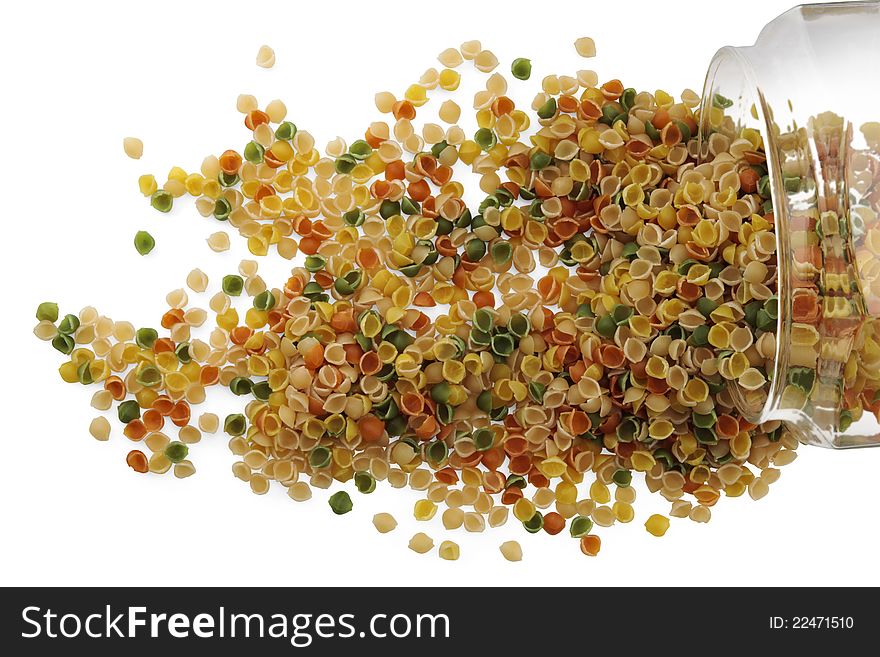 Dried pasta in a glass jar on white background. Dried pasta in a glass jar on white background