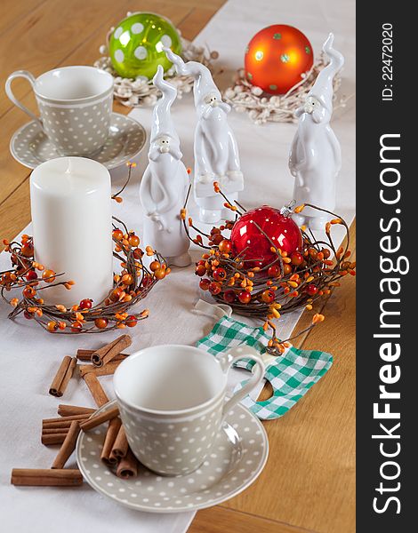 Christmas table set with cup, balls and santa claus. Christmas table set with cup, balls and santa claus