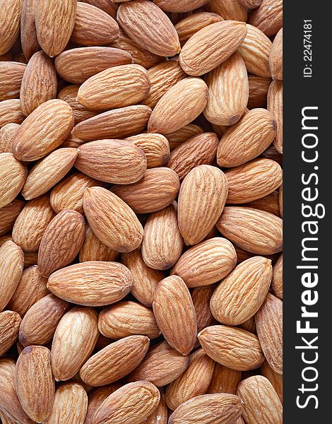 Dried almond nuts background close-up. Dried almond nuts background close-up